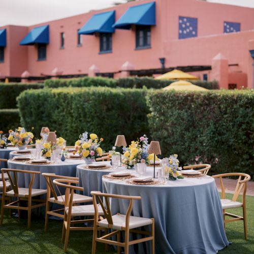 Outdoor event setup with round tables.